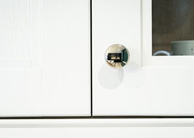 Mangan Woodcraft Classic Kitchen cabinets with white colour and chrome knob
