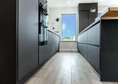 Mangan woodcraft modern black and grey kitcehn design with oak countertops ()