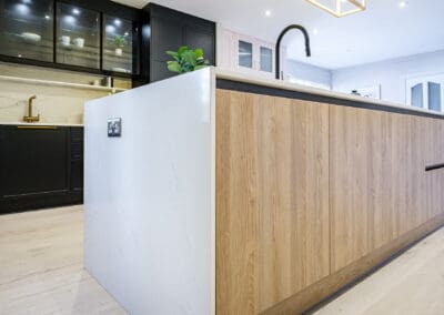 Modern kitchen island inframe design with white panelling and Oak features